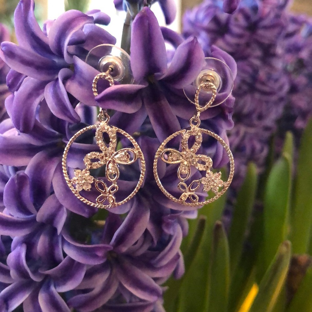 NWOT. Very cute silver floral earrings. Costume.